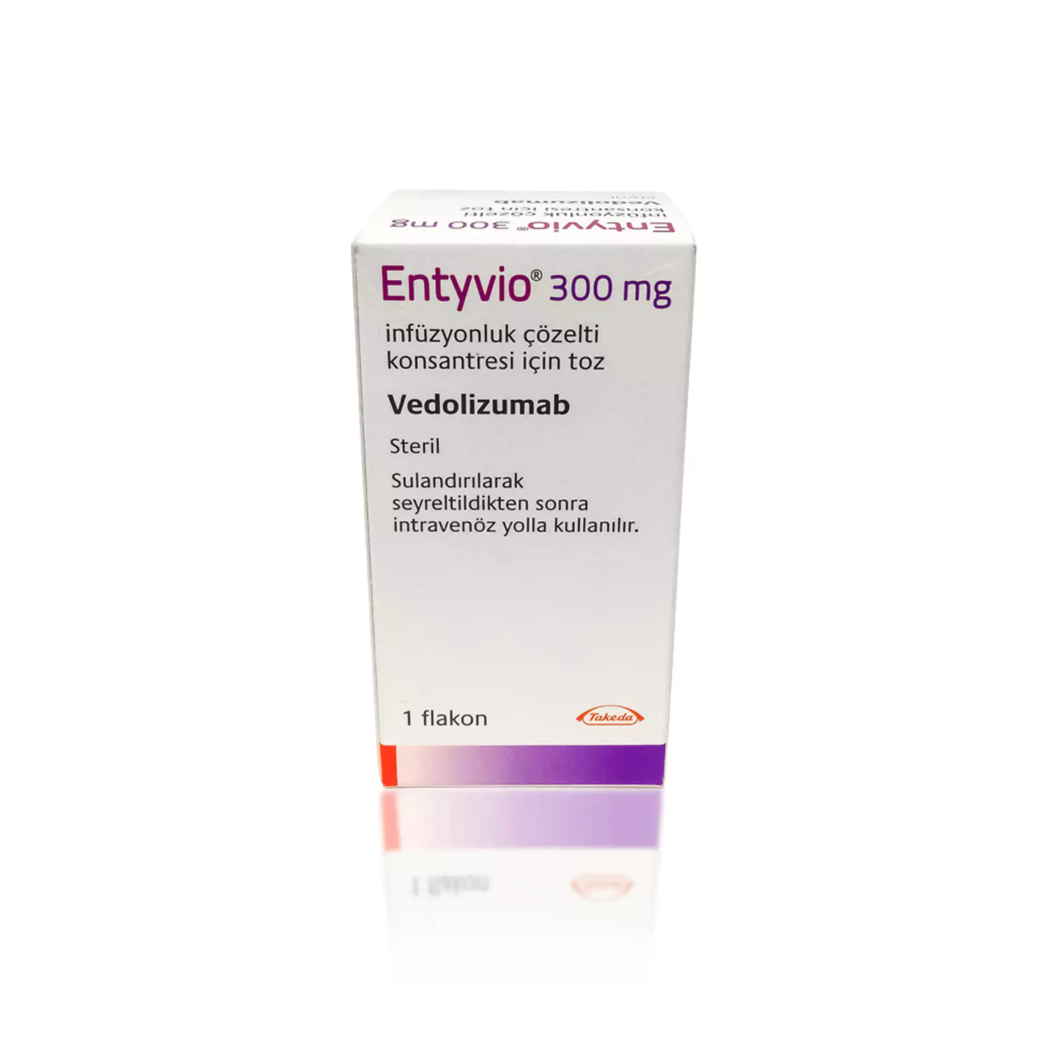 A box of ENTYVIO® (Non-English) 300 mg, containing intravenous infusion concentrate in powder form of the medication Vedolizumab. The box is white with red and purple text detailing the dosage, usage, and manufacturer.