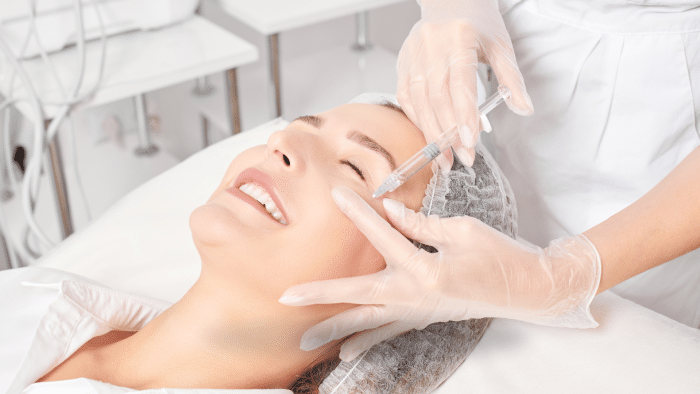 Licensed and qualified professional administering Hyacorp filler for the face.