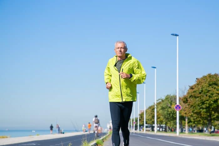 A senior jogging and training for a marathon.