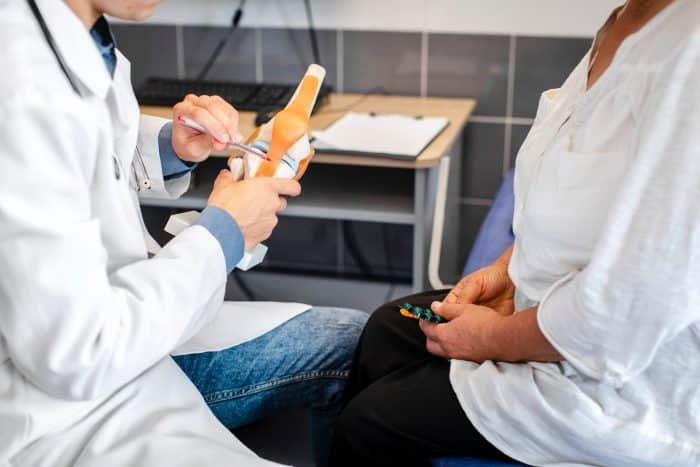A doctor explaining the joints and how they function to a patient.