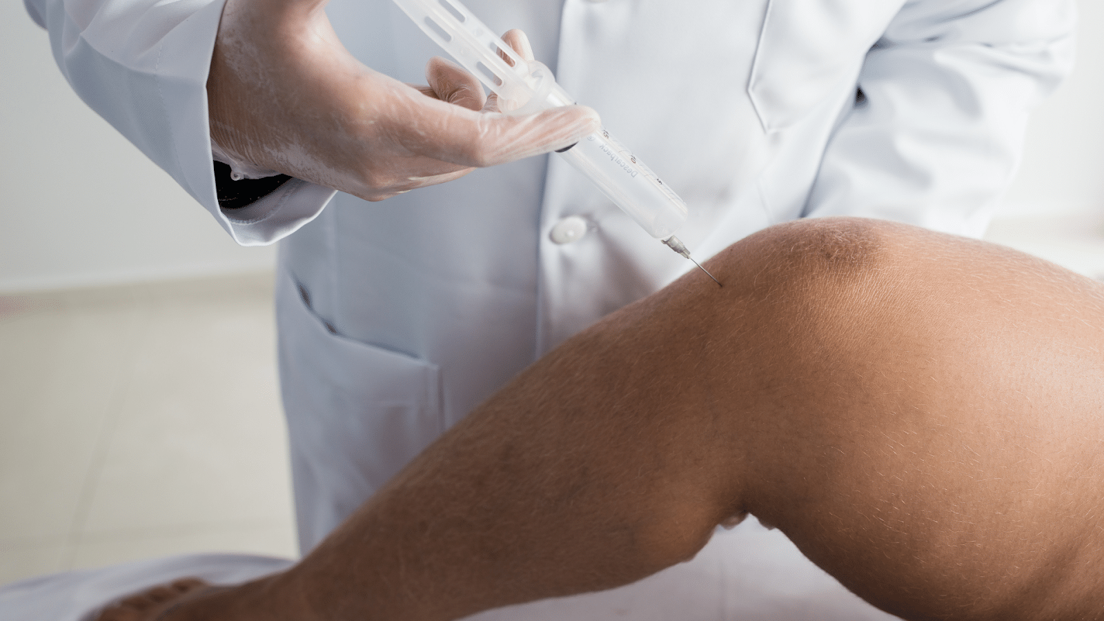 A healthcare professional administering Orthovisc for the knee.