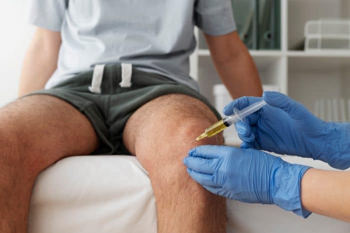 A healthcare professional carefully and strategically injects Orthovisc to help relieve osteoarthritis in the knee.