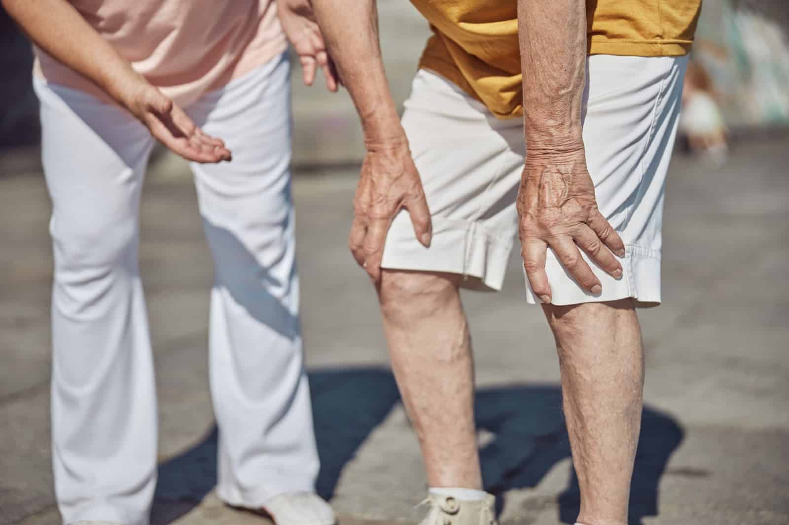 A senior male feeling pain in his knees.