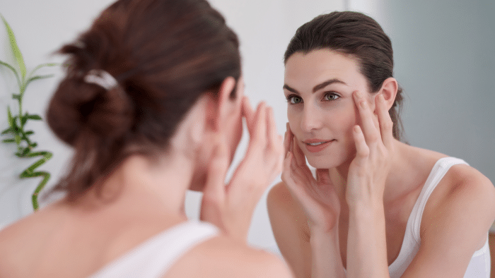 Woman following a skincare routine after getting Jalupro treatment.