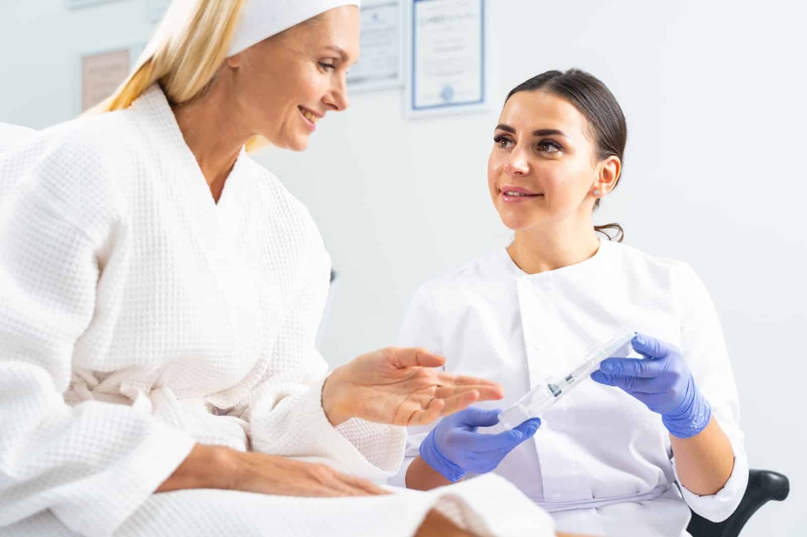 Healthcare professional showing and explaining Botox injection to a patient.