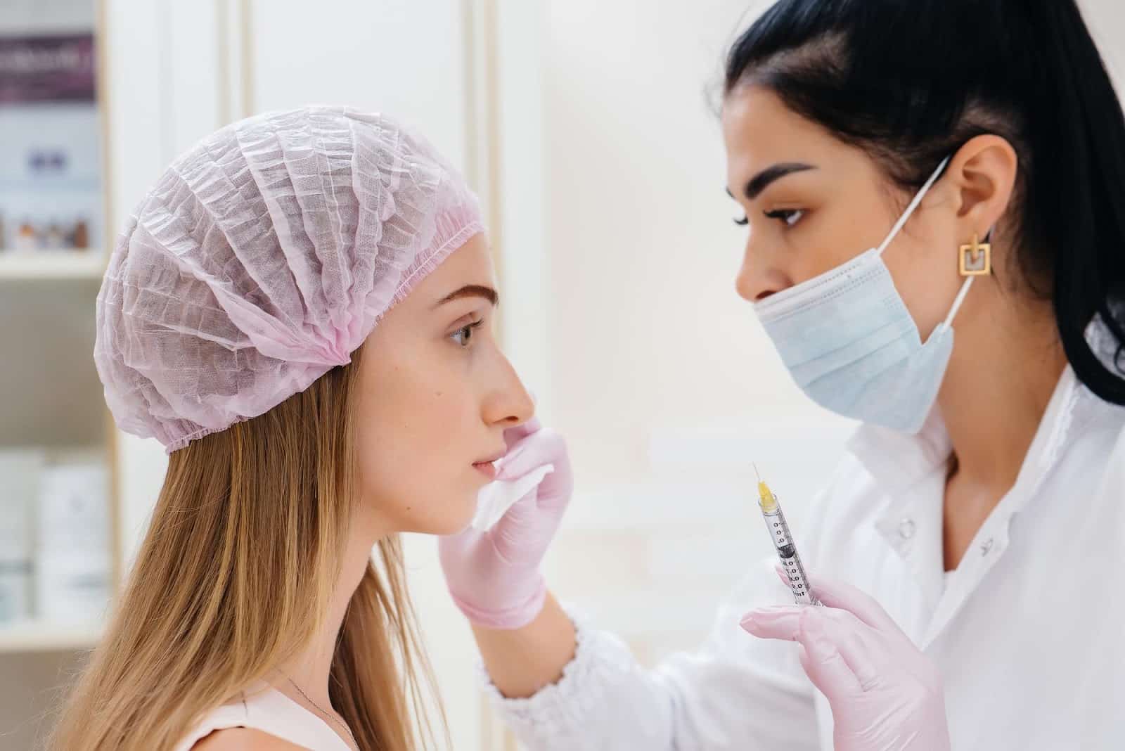 Aesthetic specialist carefully cleaning the injection site for Botox.