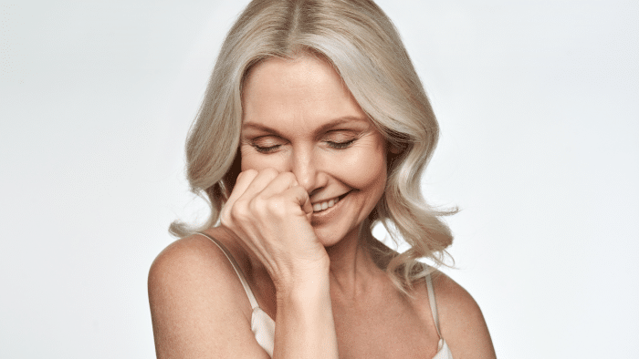 Middle-aged woman with healthy skin.