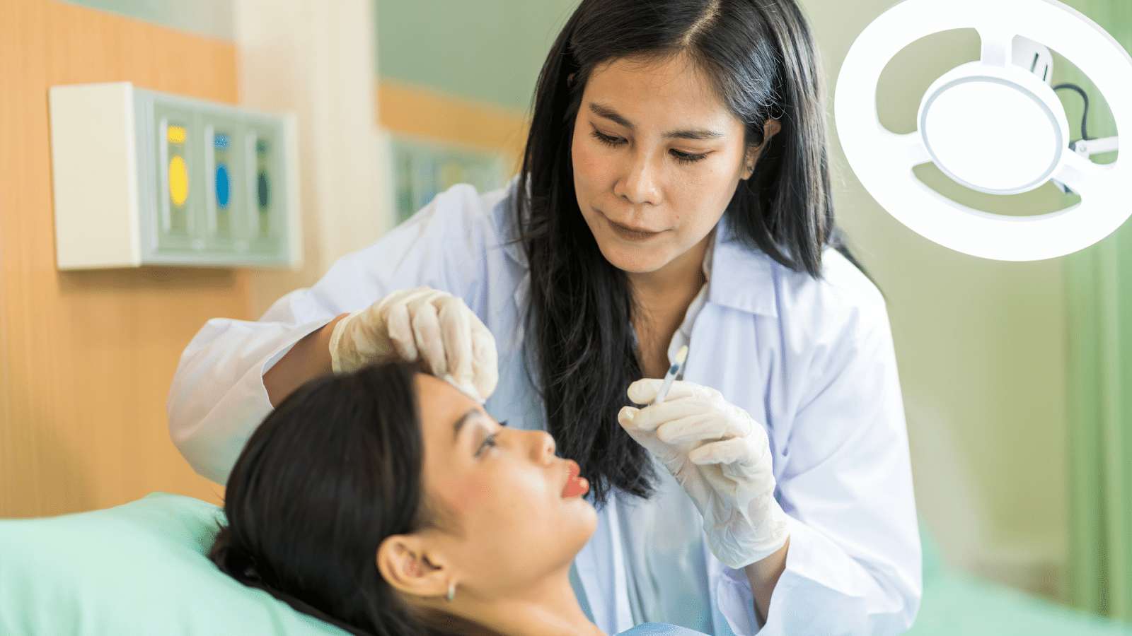 Aesthetic specialist carefully determining where to inject Botox.