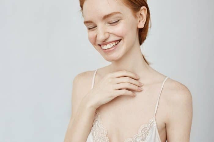 A woman feeling happy with rejuvenated and smooth skin after Dysport treatment.