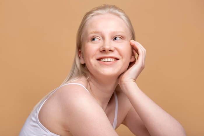 Woman feeling happy after getting Dysport injections to improve her skin.