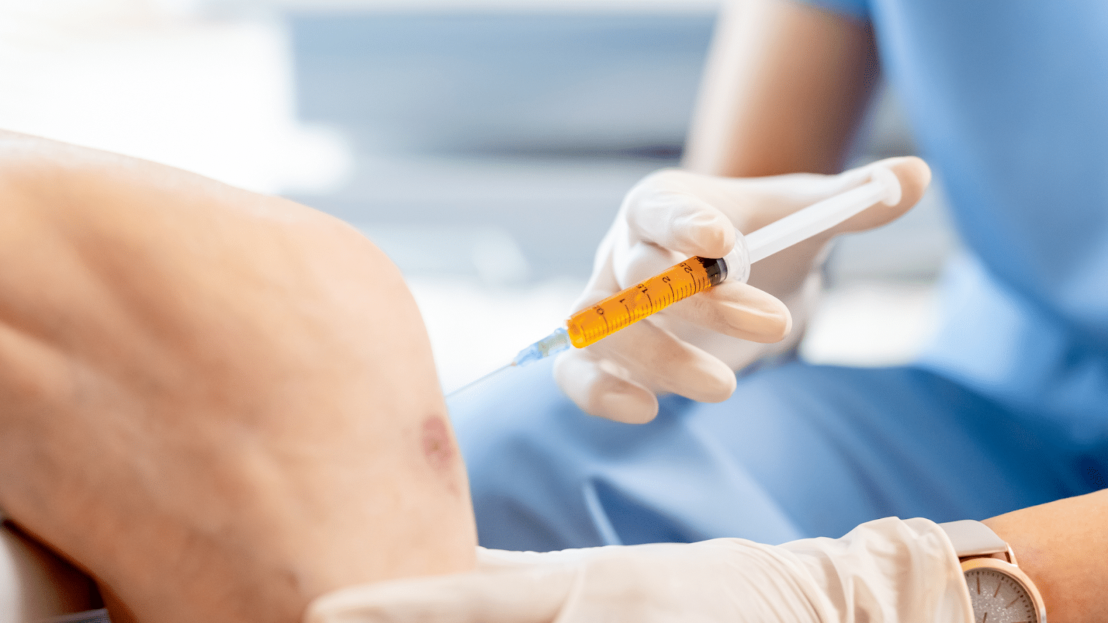 A patient receives Orthovisc injection for knee osteoarthritis.