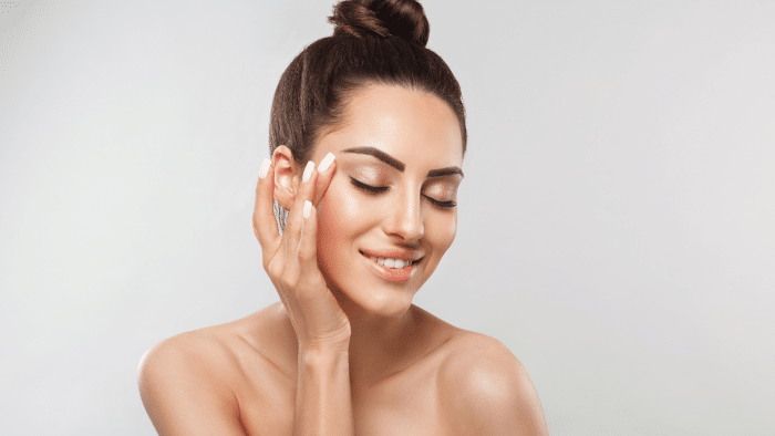 Woman getting facial treatment.