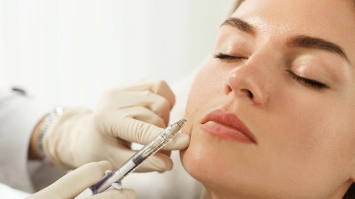 Woman getting facial rejuvenation.