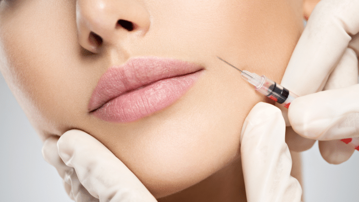 Woman getting injection. 