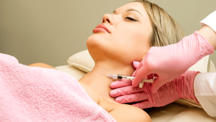 Woman getting neck injections. 