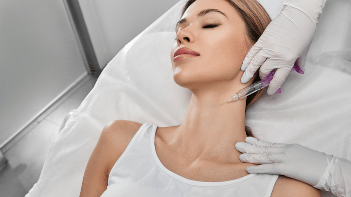 Woman getting neck injections. 