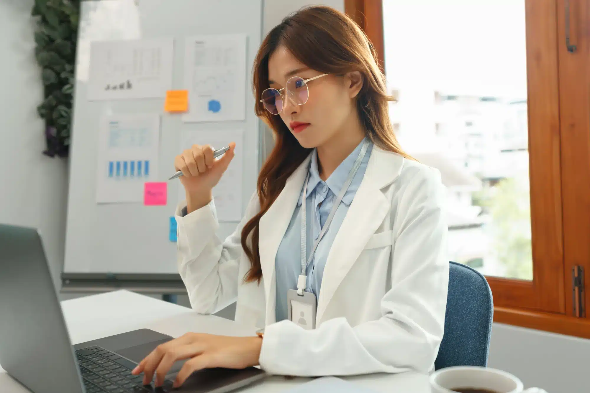 young doctor looking at her laptop