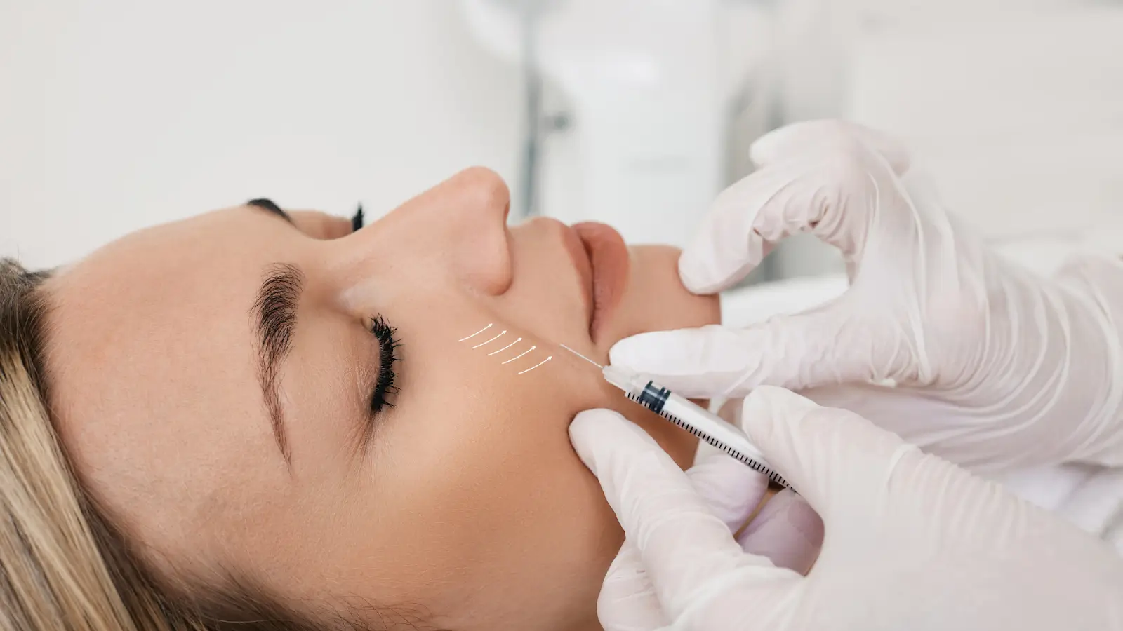 Woman undergoing facial treatment.