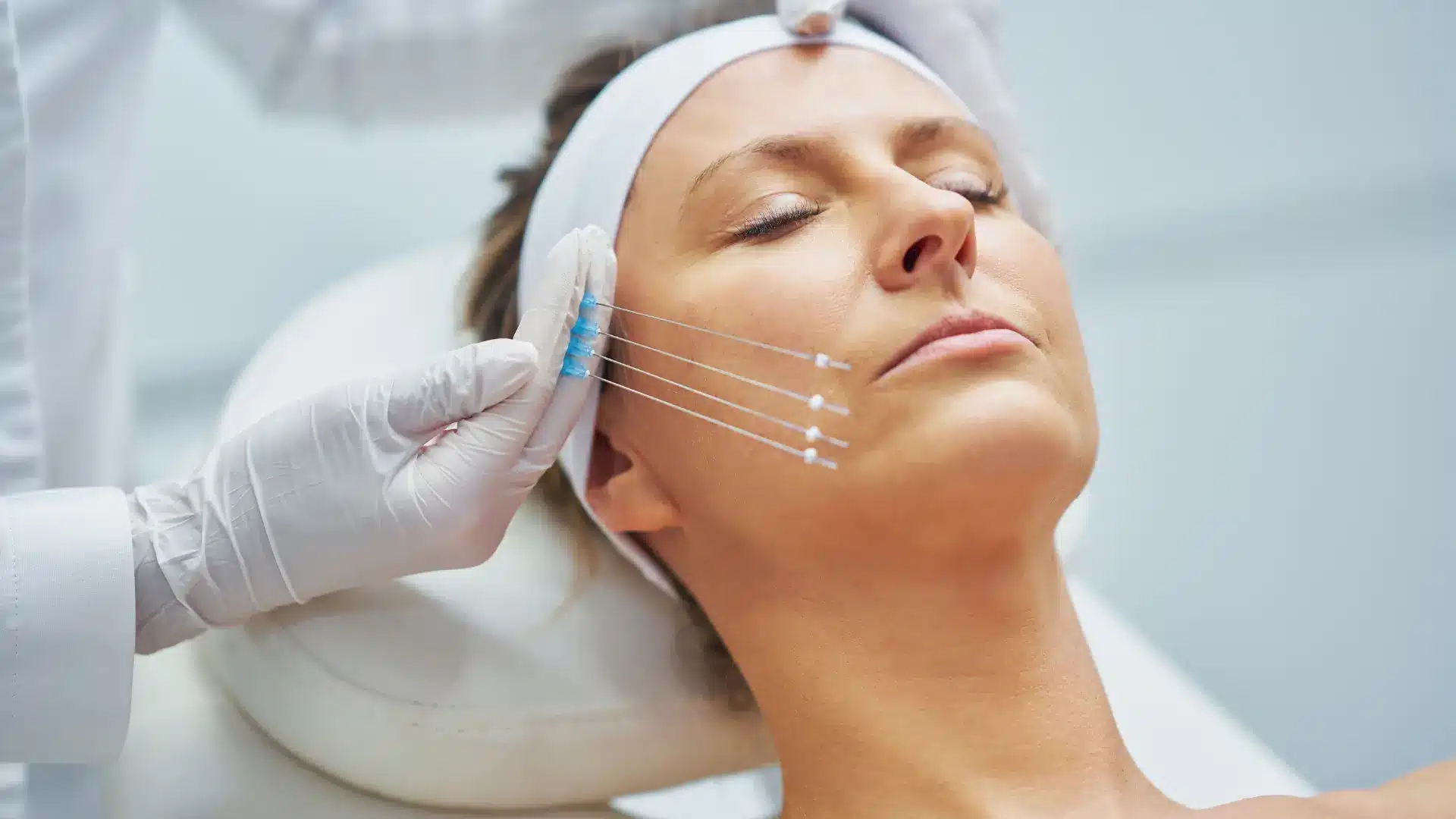 A female patient undergoes facial rejuvenation treatment.