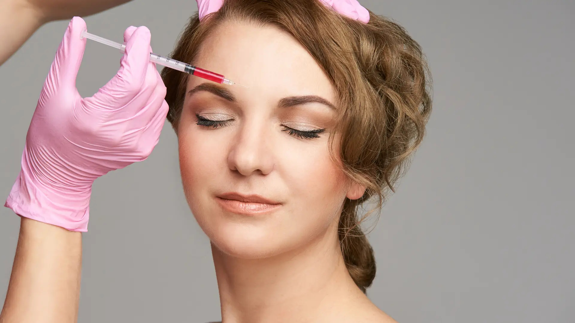 Woman getting skin booster for healthier-looking skin.