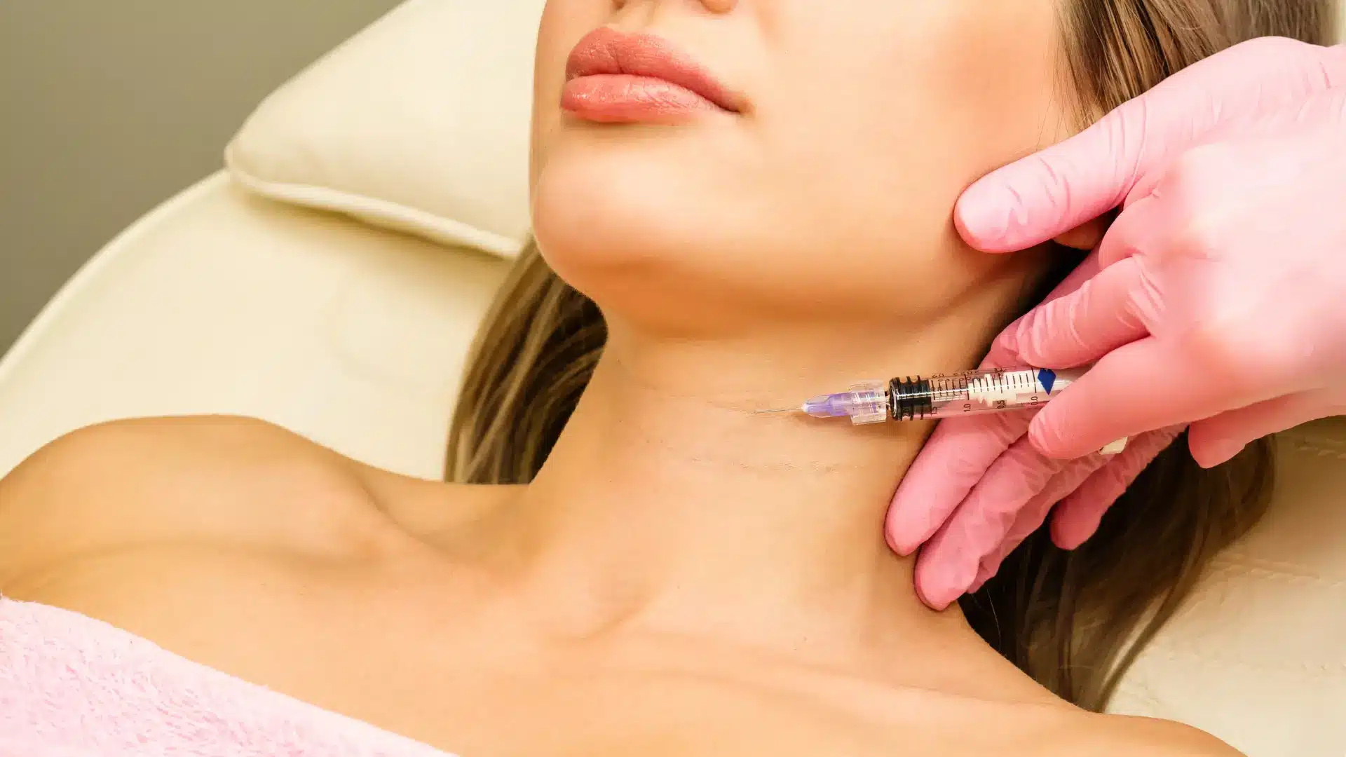 Woman getting neck injections.