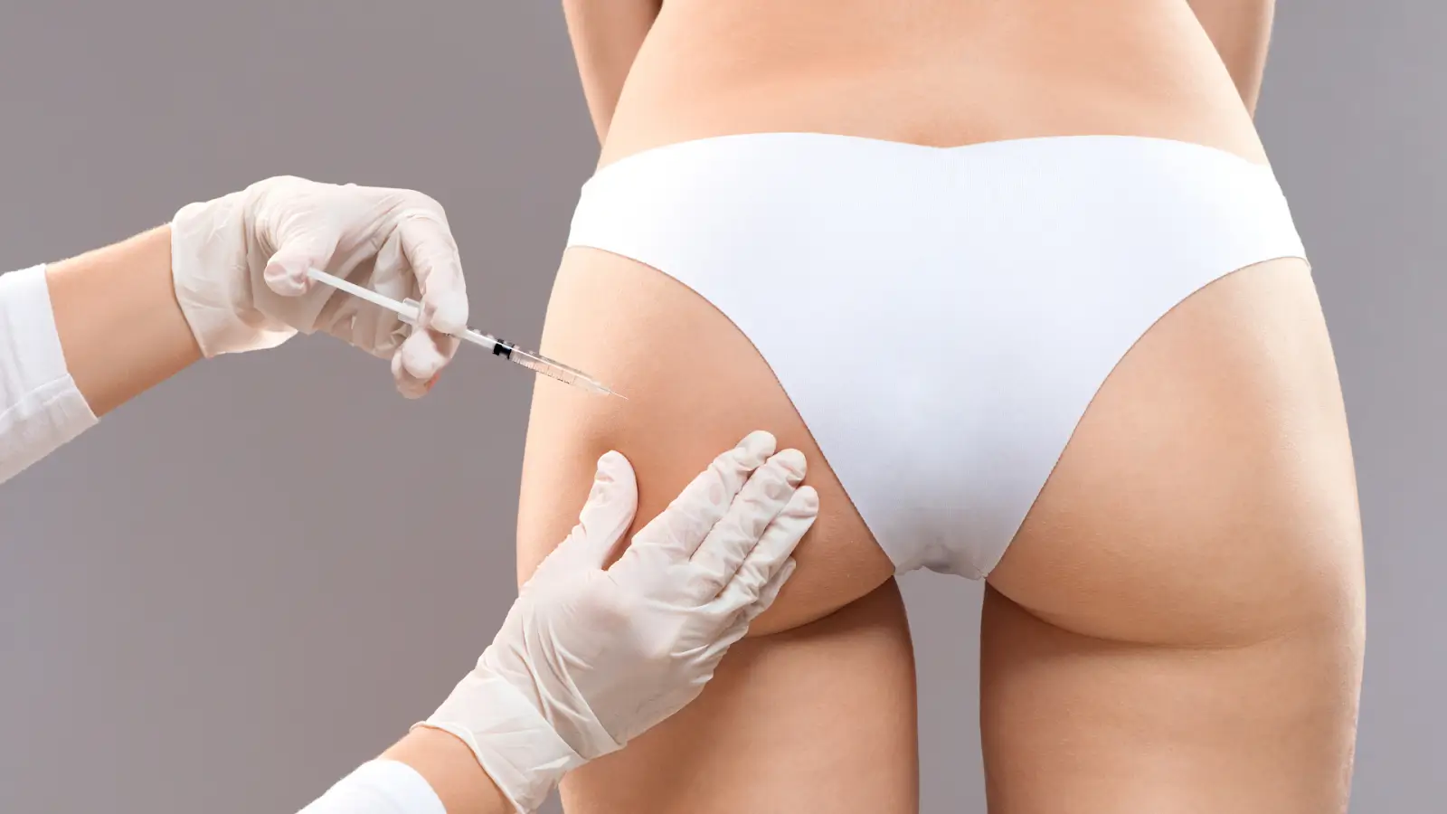 Woman's buttock getting an injection. 
