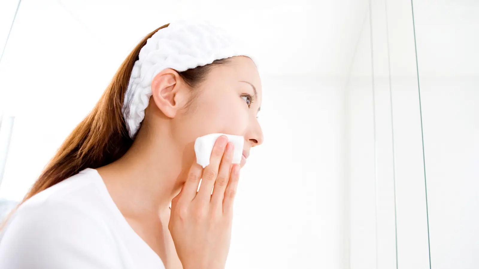 Woman cleaning her face. 