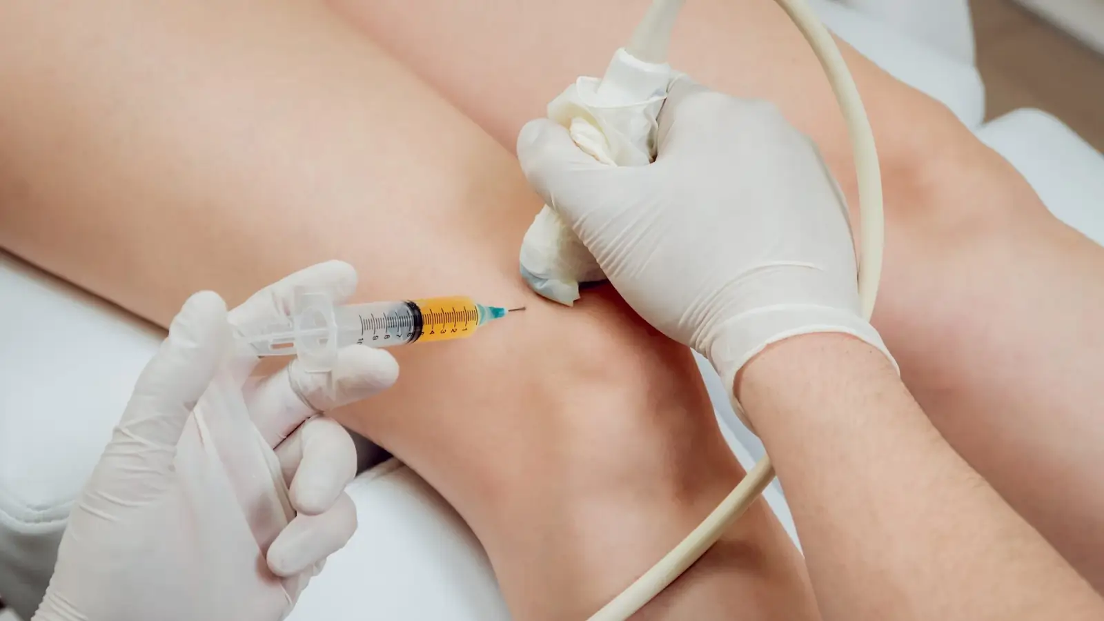 Close-up shot of a knee injection.