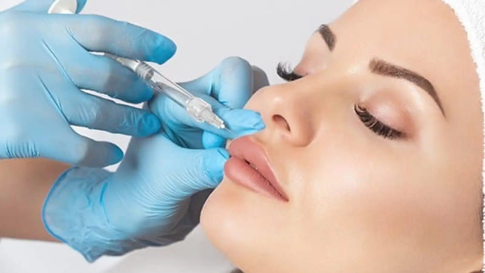 Woman receives filler treatment.
