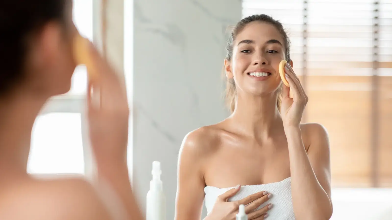 Woman looking in a mirror. 