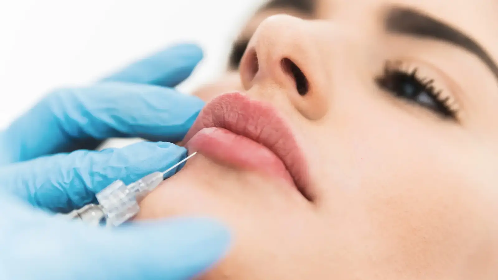Woman getting face injection.
