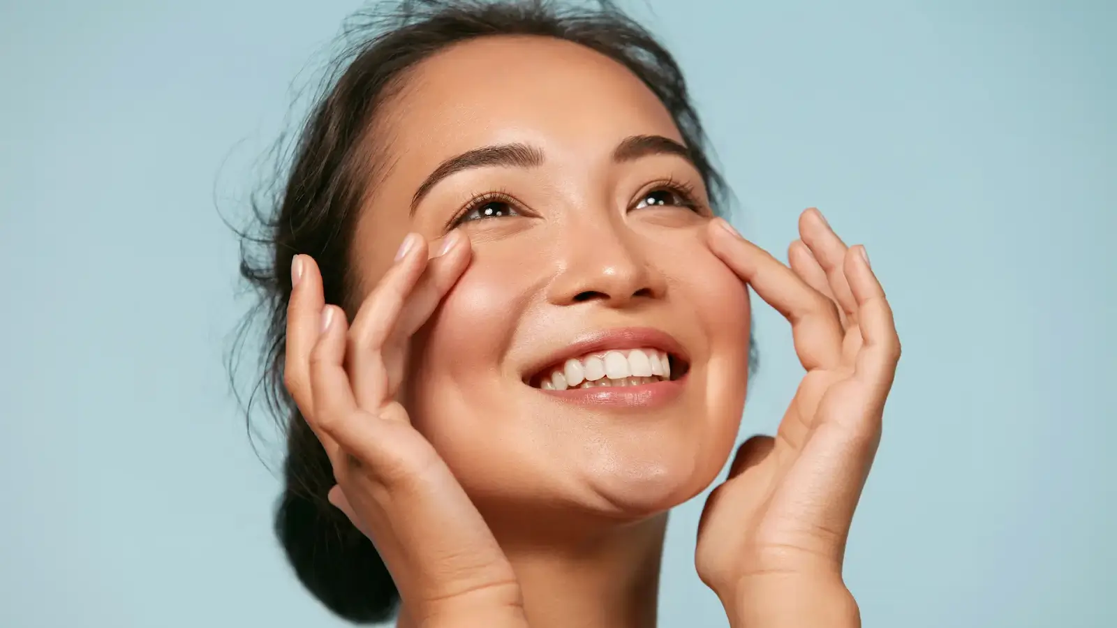 Woman touching her face.