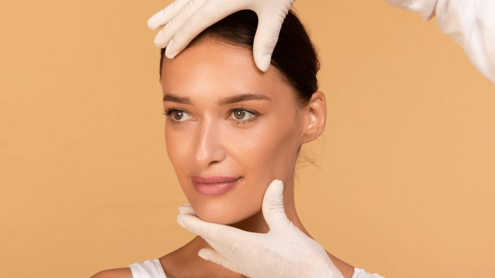 professional inspecting a woman's results