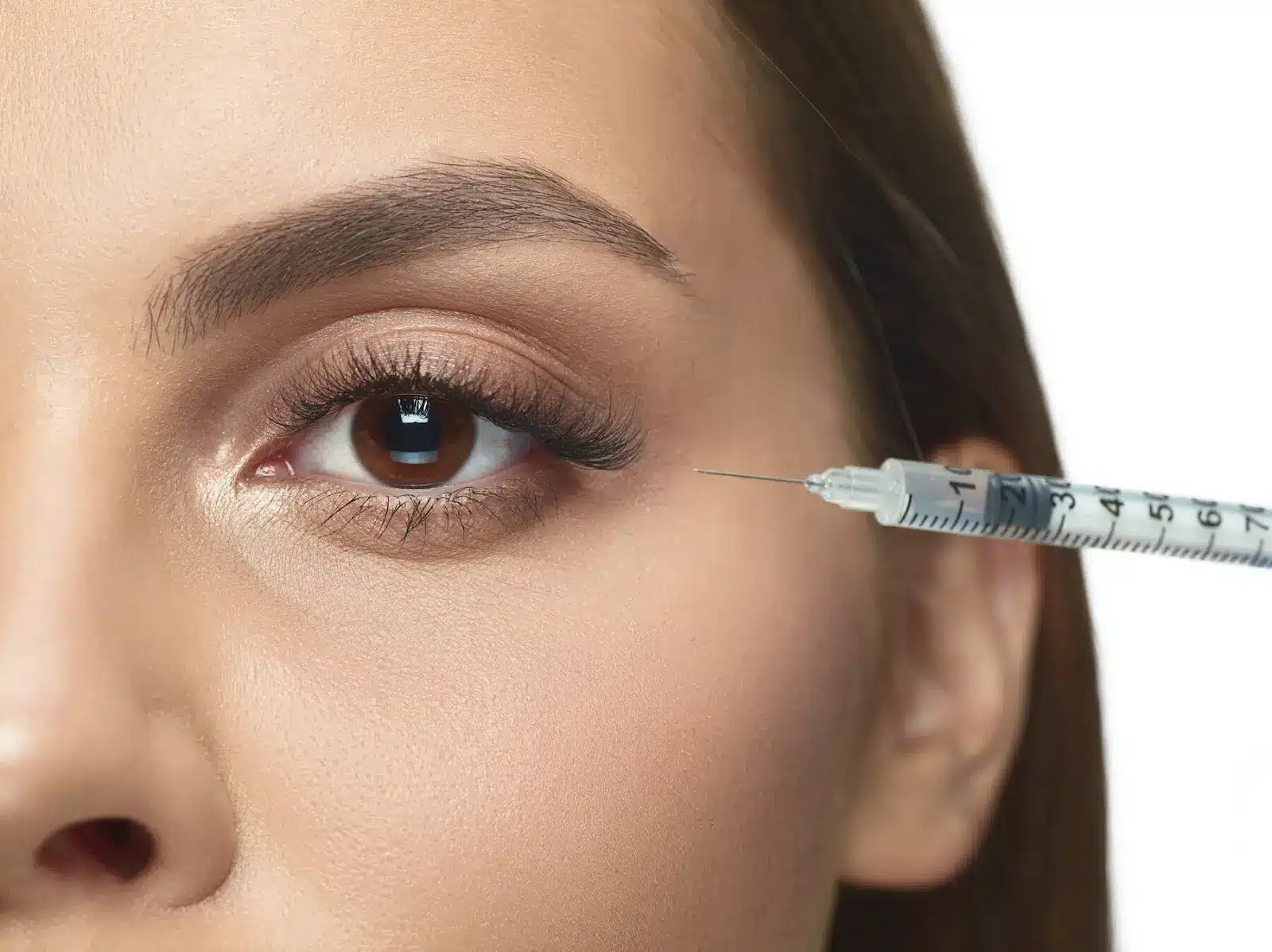 Person getting eye injection.