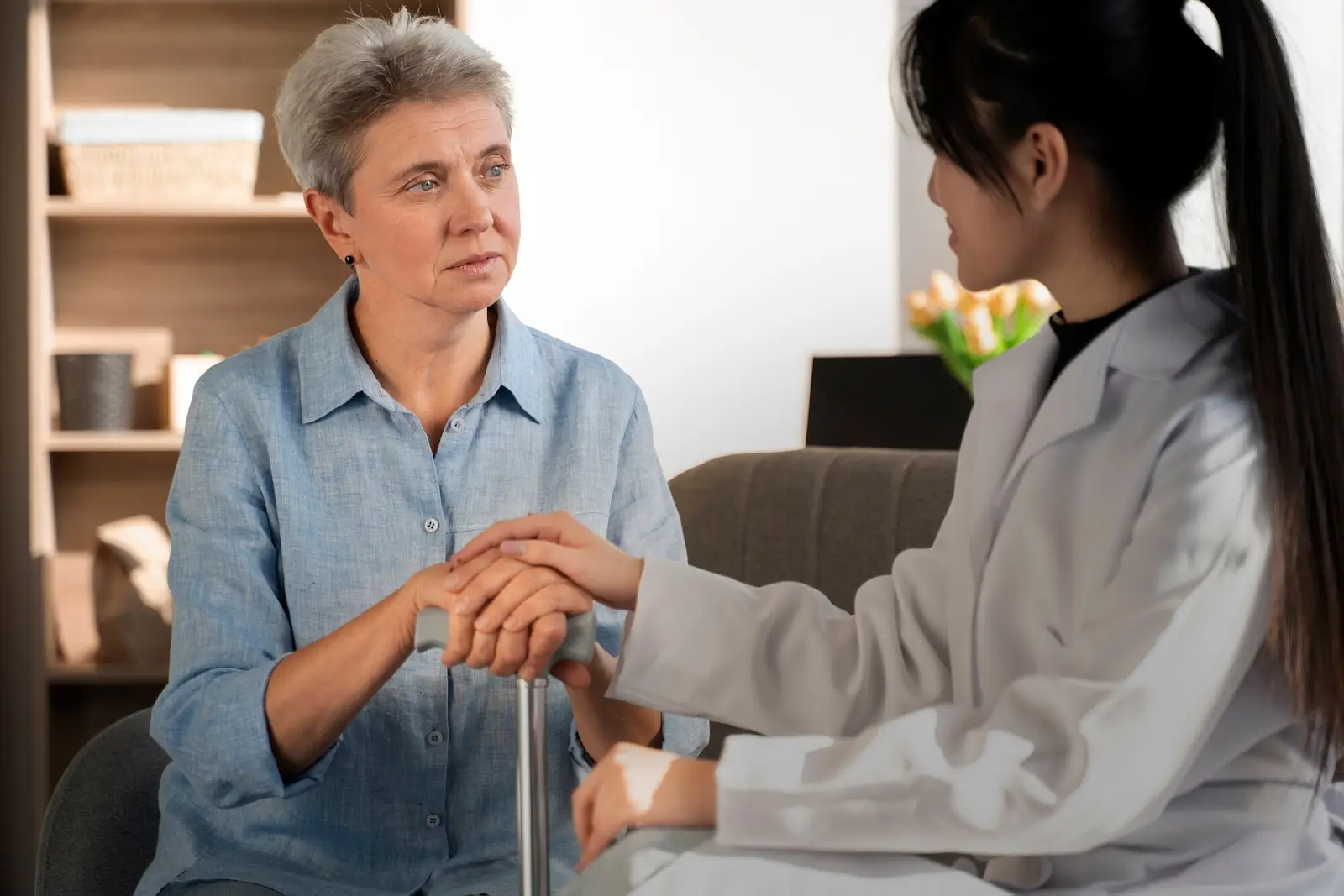Person consulting with doctor.