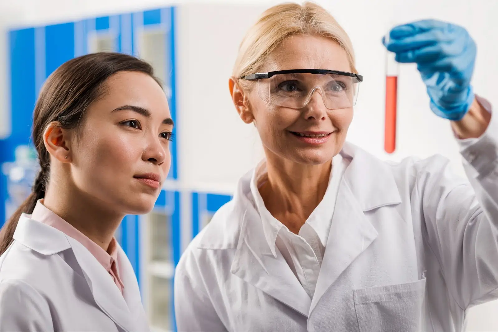 People in lab talking with each other.