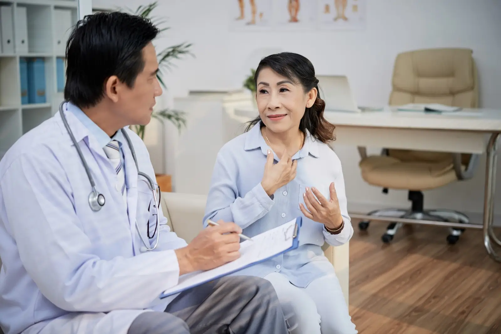 Patient talking to doctor.
