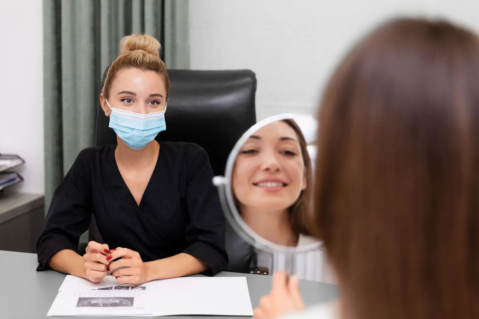 Patient checking face in mirror.