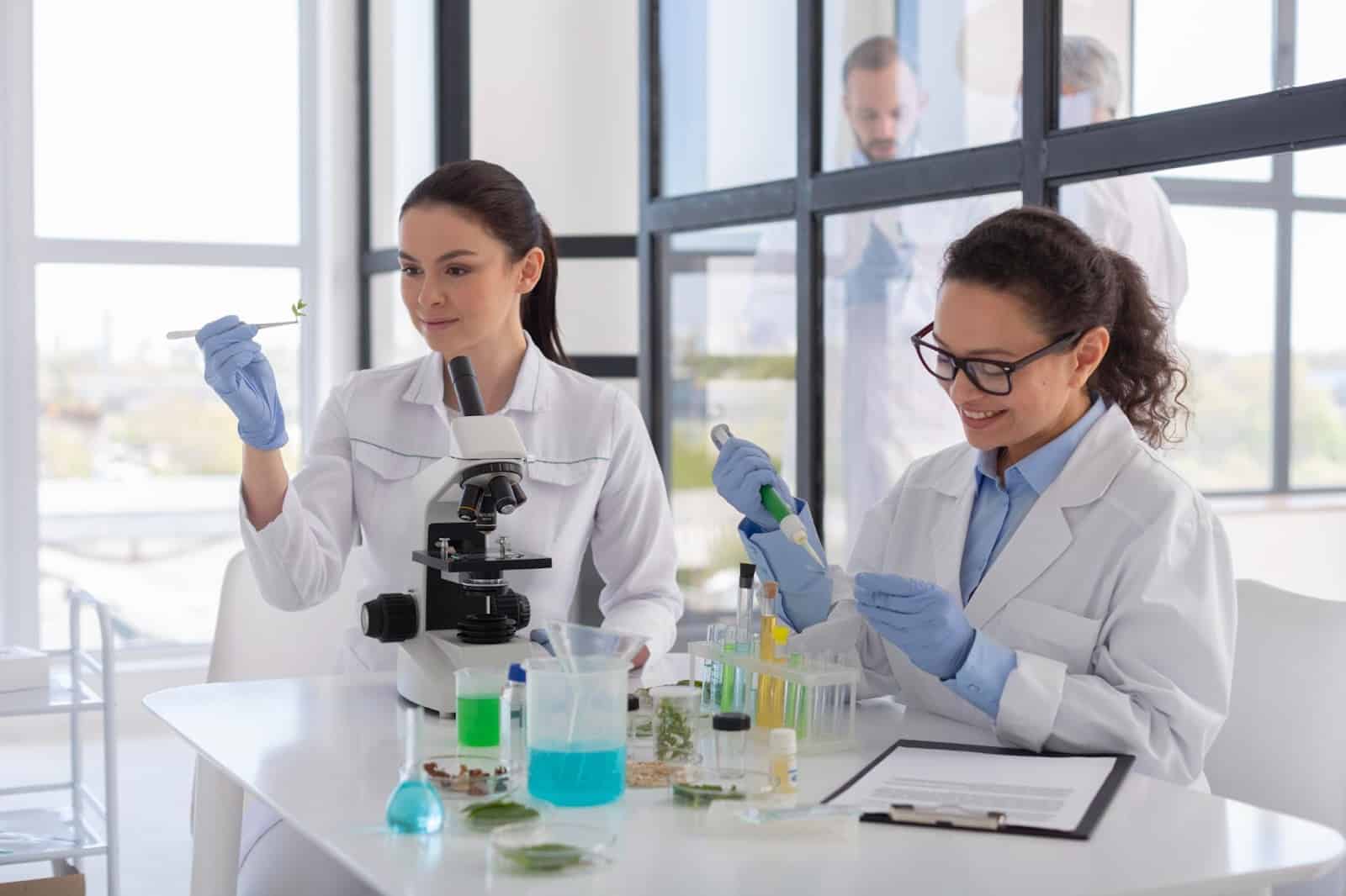 People in lab looking at chemicals.