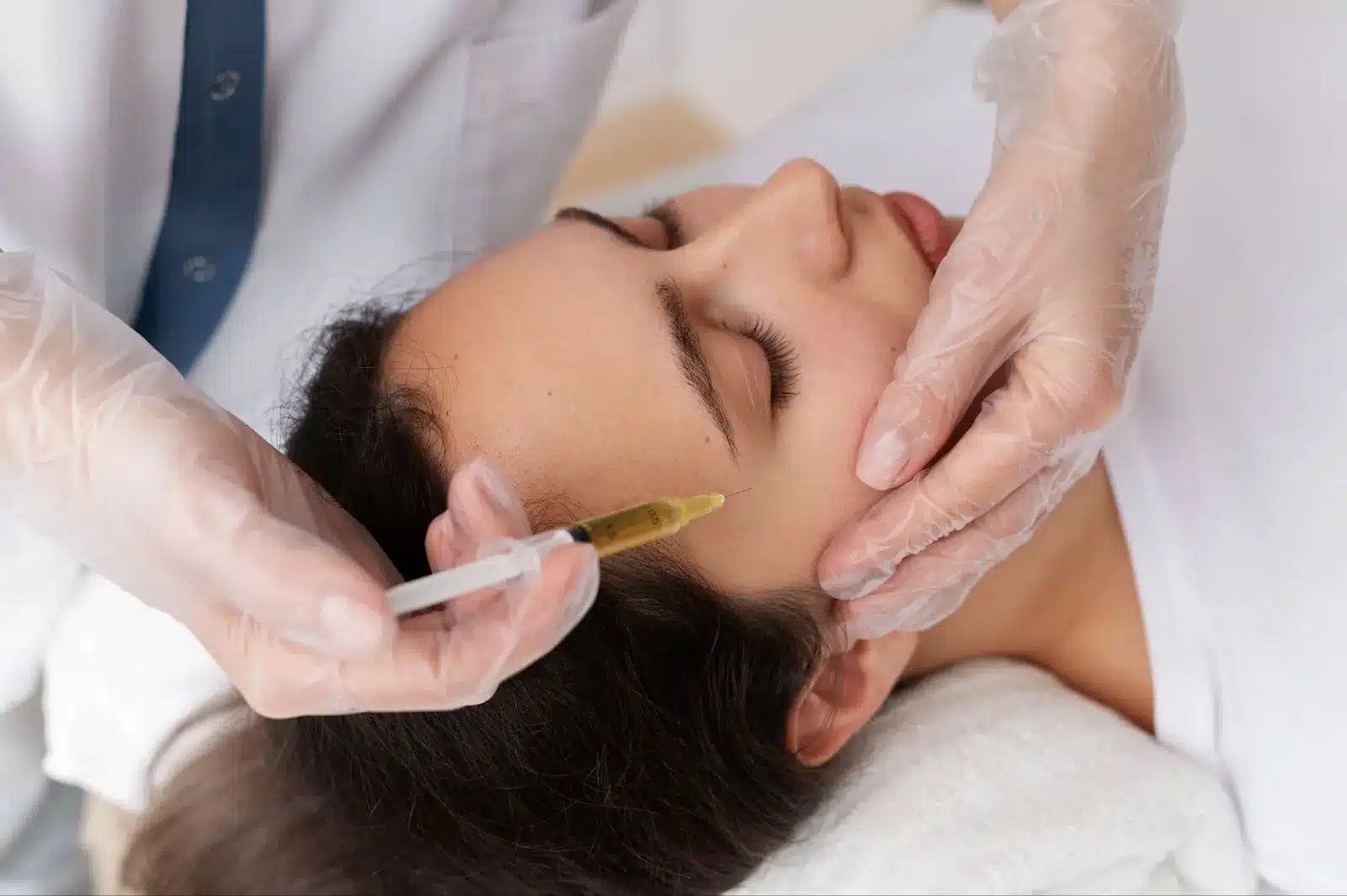 Person getting a facial injection. 