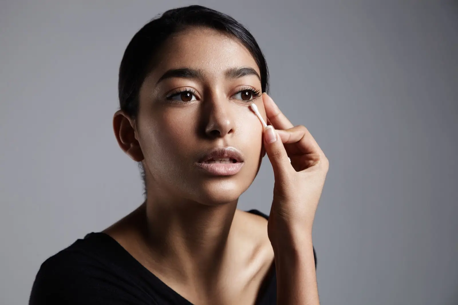 Person checking her eyes.