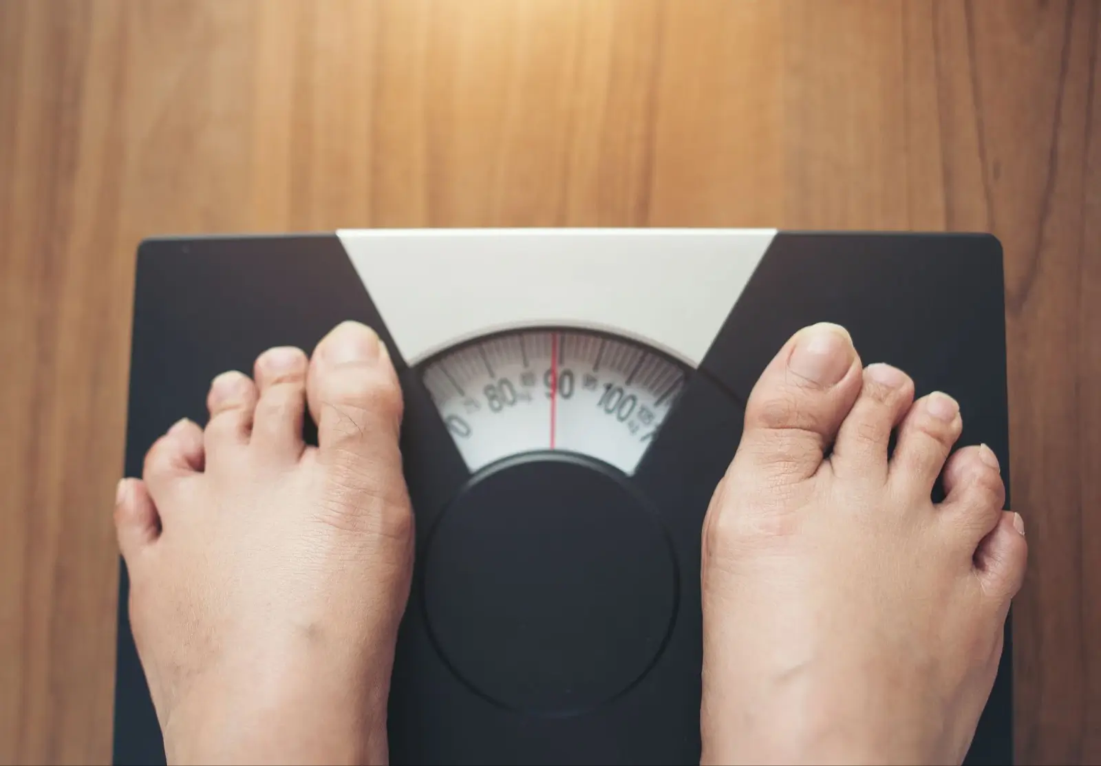 Person on a weighing scale.