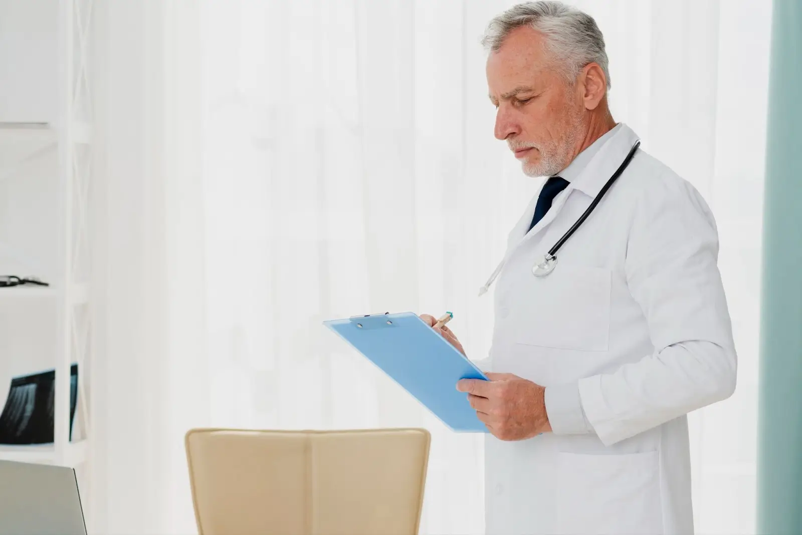 Doctor looking at chart.