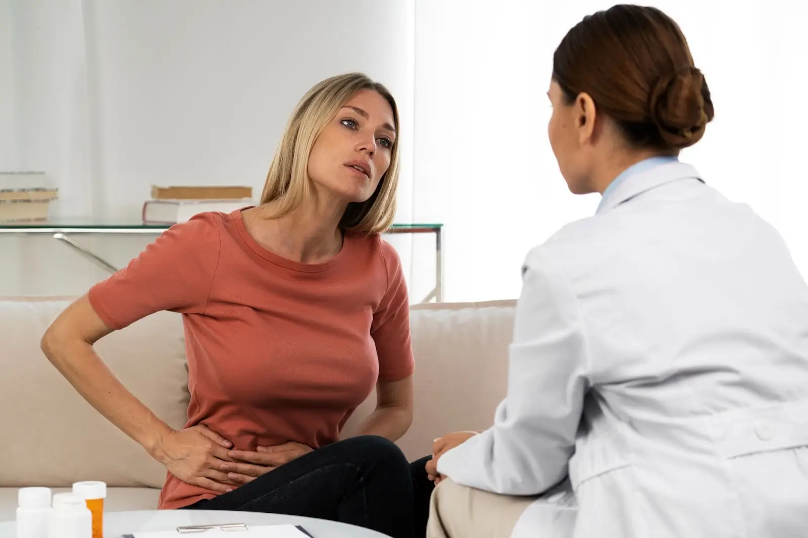 Person talking to doctor. 