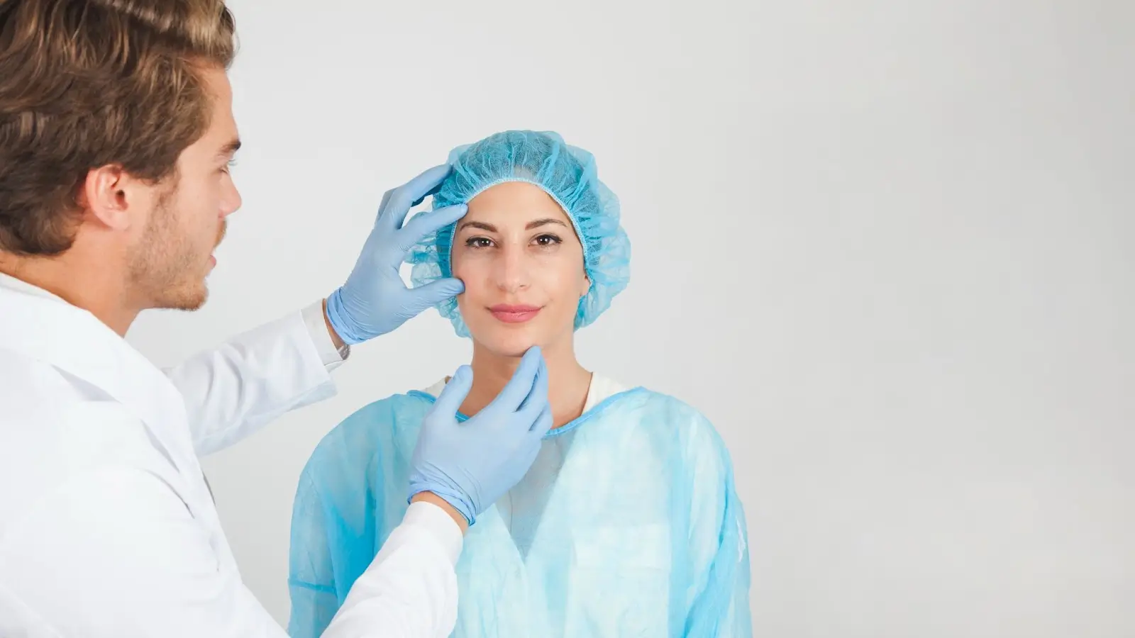 Doctor checking face.