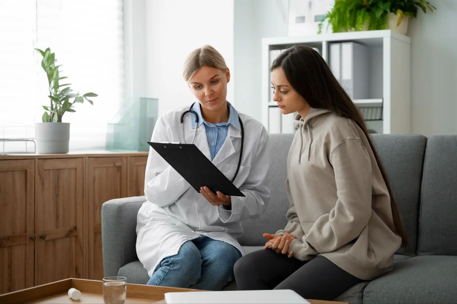 Person talking to doctor.