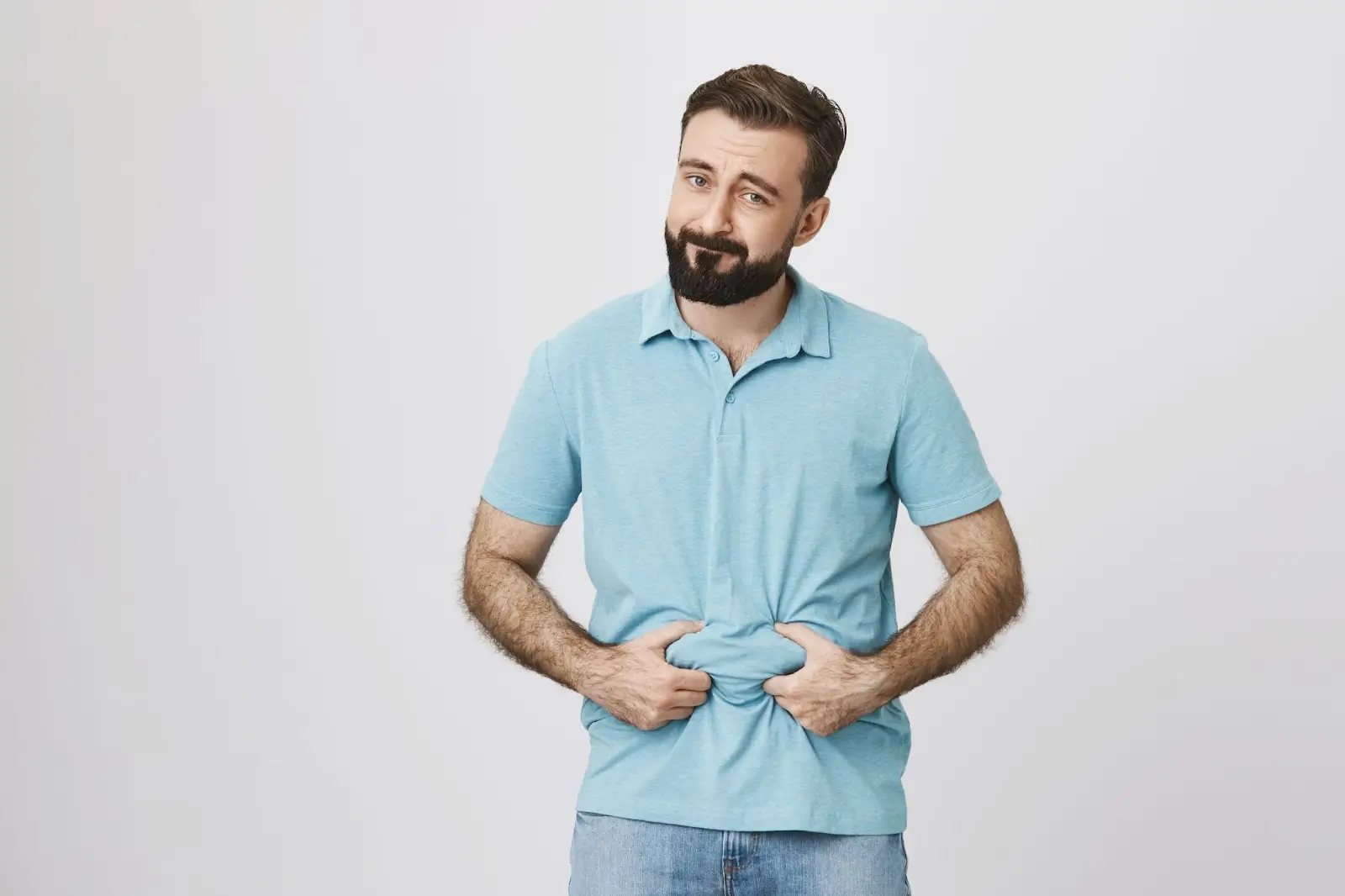 Person clutching stomach. 