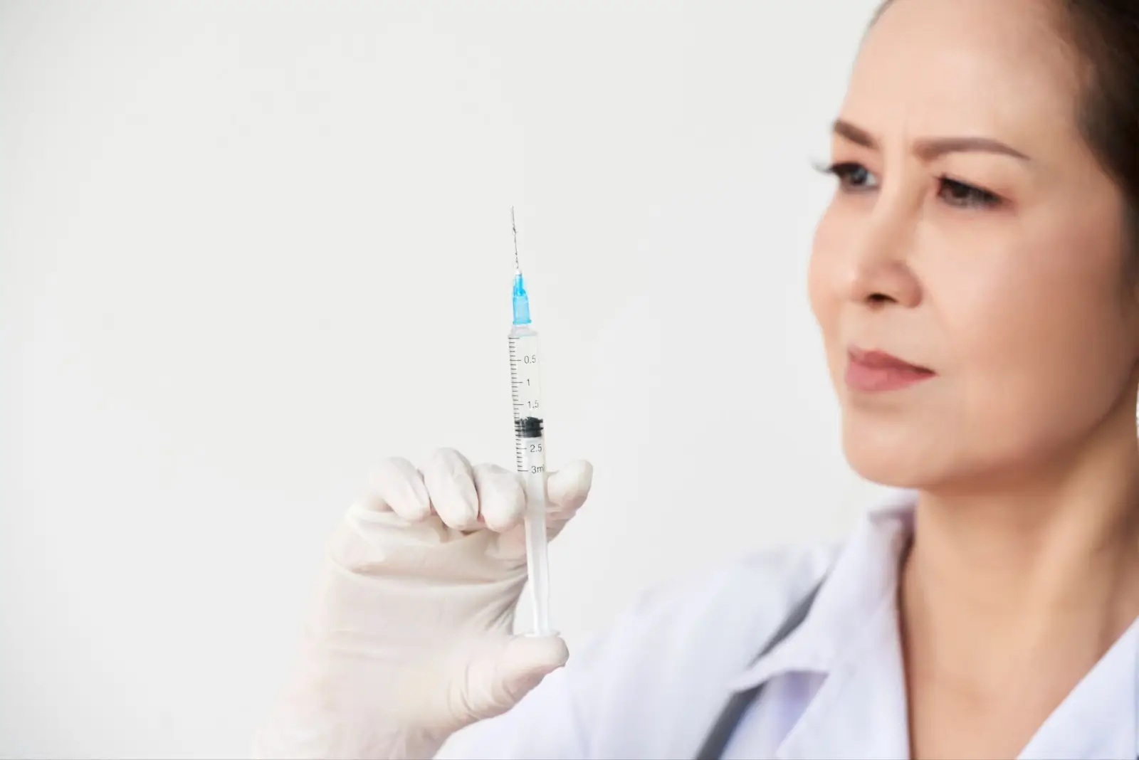 Person holding injection.
