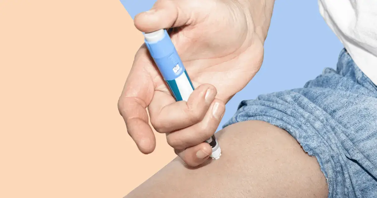 Person injecting self with Ozempic.