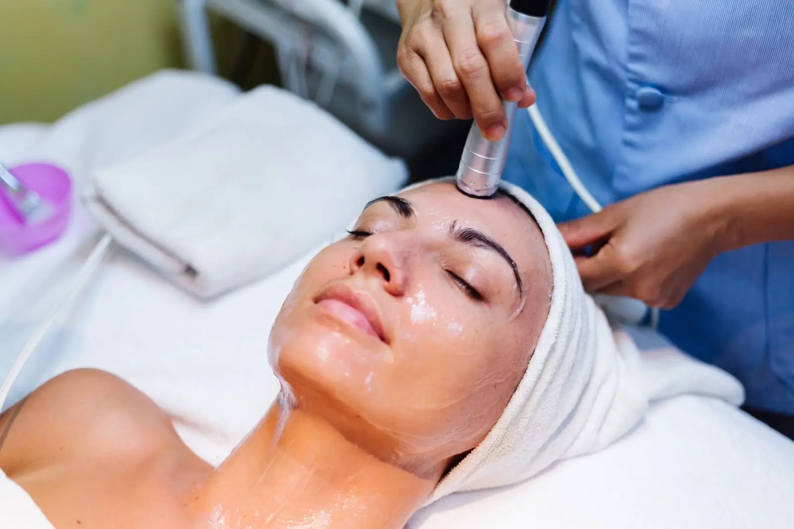 A person lying down and getting applied with PRX T33 treatment.